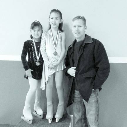 Maliah and Lana Utley with their coach, Kelly Evans