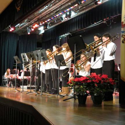 Grade 7 Trombone players Mikayla Barton, Cindy Cintron, Nicholas Conway, Nathaniel Dokum, Emmaleigh Janetzko, Mackenzie Keane, Frances Starace, and Madison Struck perform "Dance of the Slippery Slide Trombones."