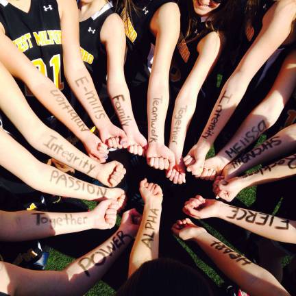 Members of the girls JV team wrote pump up words on their arms to get excited before a game.&#xa0;