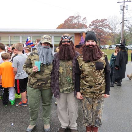 These burly" fellas" are sixth grade teacher Dianne Byers, special education teacher Martha Cook and sixth grade teacher Kathy Marxen channelling their best Duck Dynasty.