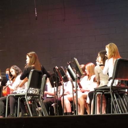 Flute players from the 8th grade band perform.