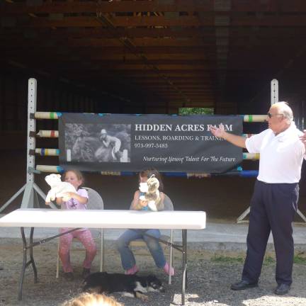 Kids listen as Patrick Chierichella discusses safety around strangers.