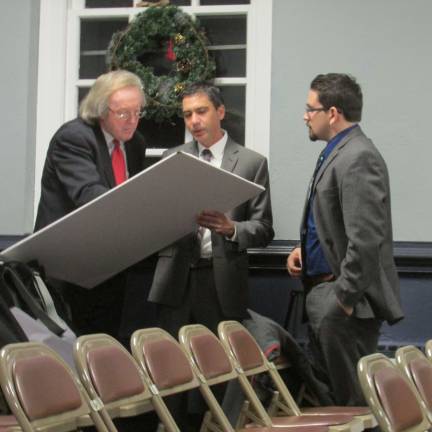 PHOTO By Ann Genader West Milford LLC (ShopRite) professionals discuss the plan for the refurbished supermarket prior to meeting with the West Milford Planning Board.