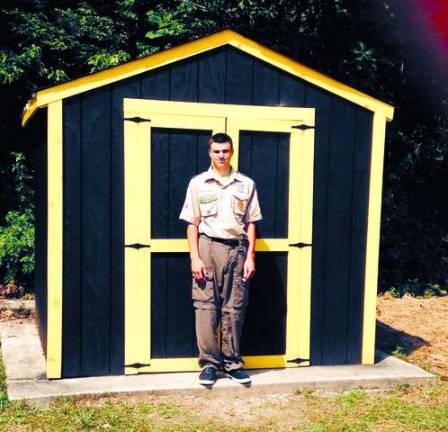 Photos provided by Krista Provost The finished product, along with Harrison Christen, who built the shed as his Eagle Scout project.