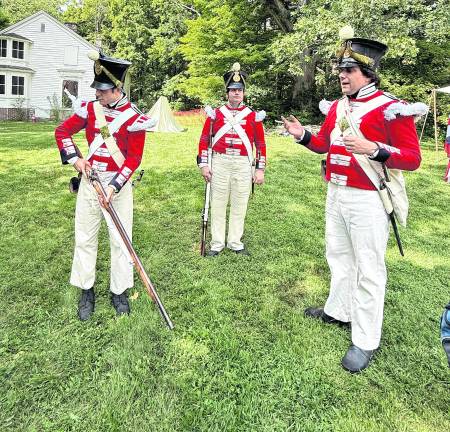 Kyle Parker, John Van Vliet and Jesse Gerber dress as British soldiers.