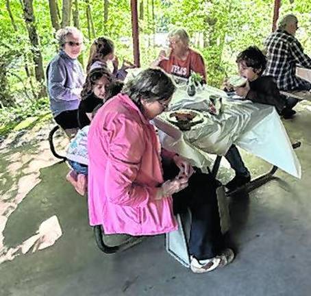 West Milford councilwoman Marilyn Kichtenberg sits with particpants.