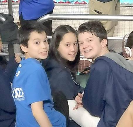 From left are Zachary McKatten, Samantha McKatten and Tyler Roer at a Rutgers University Junior Olympic swim meet in March 2019.