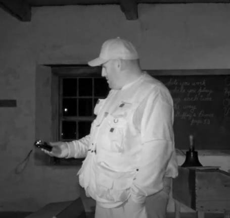 Dan Pacella investigates the schoolhosue at Museum Village in Monroe, NY.