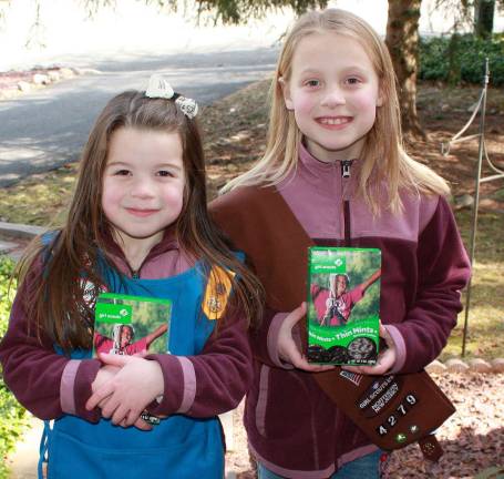 It's cookie season! Always great to see at your front door - Girl Scouts and their wonderful cookies. Pictured here is, on left, Elizabeth Marci, a Daisy Scout from Troop 4896, and Lauren Marci, a Brownie from Troop 4279. Who wouldn't buy Thin Mints from these adorable Scouts? Photo by Ginny Raue