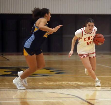 Taylor Hough playing basketball at Kings College.