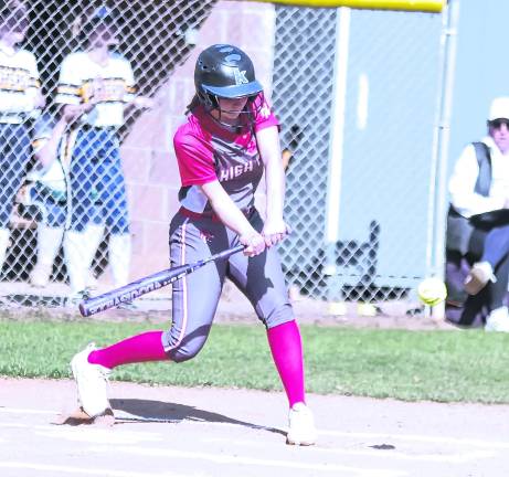 <b>High Point batter Abby Macfie swings at the incoming ball. Macfie drove in one run.</b>