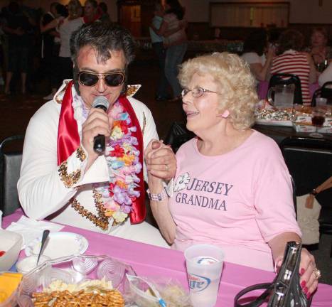 Jersey Grandma, Barbara Cox, swoons a little as Elvis, also known as DJ Lou, sings &quot;I Can't Help Falling in Love with You&quot; at the Sock Hop.