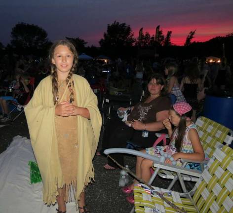 Nine-year-old Sage dressed as Pocahontas for the evening. What a beautiful sky behind her as night fell on West Milford during Thunder in the Highlands.
