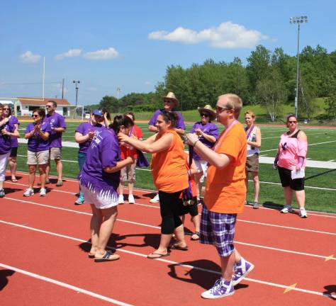 Cancer survivors receive a medalion before the first lap begins.