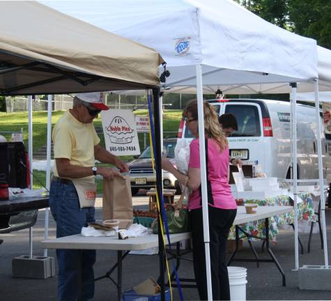 Yummy strawberries were in demand at the market. Och's Orchard from Warwick is a new vendor.
