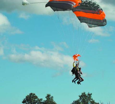 Photo by Claudia Caramiello Skydivers take to the sky.