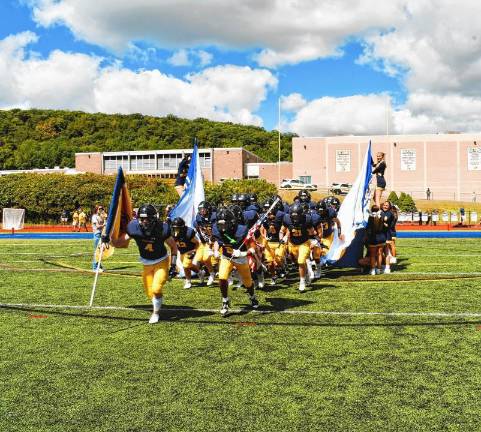 <b>JF2 The Jefferson Township High School football team runs onto its home field for the season opener against High Point.</b>