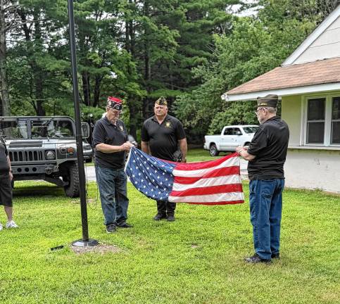 Members of the West Milford Veterans of Foreign Wars Post 7198 conduct a flag retirement ceremony July 12 at their building at Melody Lake on Cahill Cross and Ridge roads. (Photos provided)