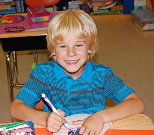 Gabe had an exciting day in first grade. He was making a butterfly.