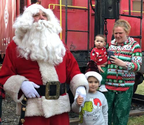 Santa greets people at the Newfoundland Train Station on Saturday, Dec. 9 after arriving with Operation Toy Train.
