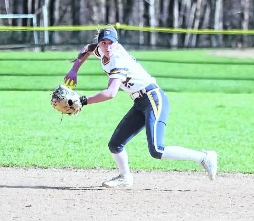<b>Jefferson infielder Kylie Plunkett in the midst of a throw towards first base.</b>