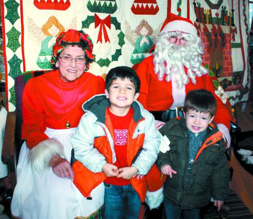 Savlatore Signorino, 5, left, and little brother, Joseph, 3, weren't a bit shy while visiting with Santa and Mrs. Claus at the West Milford Museum.