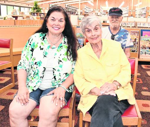 Linda Hogan and Helan Balala, both of Sparta, enjoy the show.