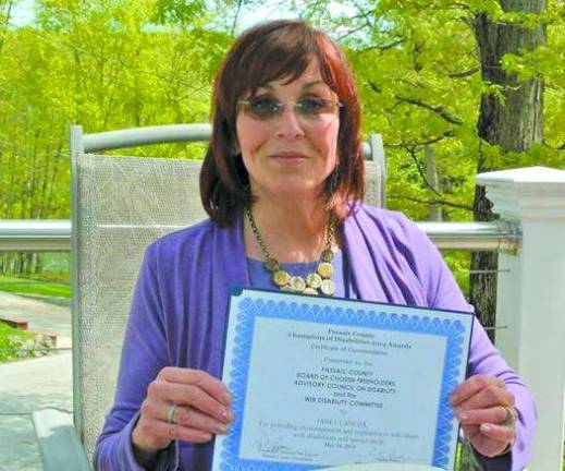 Janet Laycox was named a champion by the Passaic County Board of Chosen Freeholders Council on Disability. She is a volunteer at the West Milford Animal Shelter, the P.R.I.D.E. Program and serves on several committees to help those with disabilities.