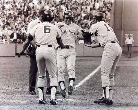 This iconic photo was taken on Oct. 2, 1978 when Bucky Dent sent a pitch over the Green Monster in Fenway Park, putting the Yankees up in that one-game playoff. Chris Chambliss, right, and Roy White greeted Dent as he crossed home plate.