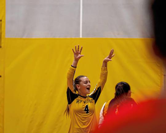 Senior Skylar Locke celebrates a point in the volleyball team’s season-opener against Indian Hills at home Monday, Sept. 8. The Highlanders won, 2-0. (Photos by TJ Nolan)