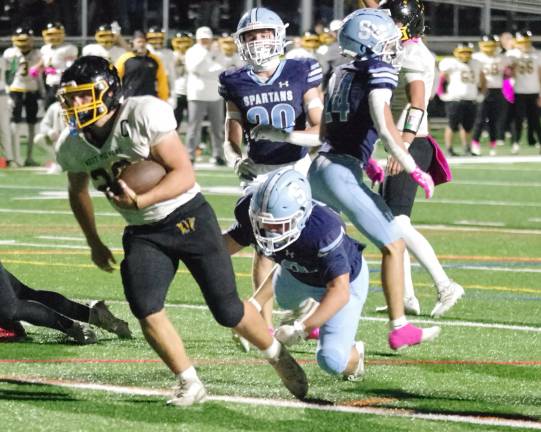 West Milford ball carrier Jeffrey Papienuk crosses the goal line for a touchdown in the first half. Papienuk scored three rushing touchdowns in the game.
