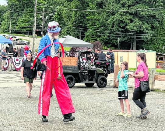 Uncle Sam performs on stilts.