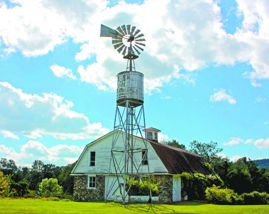 The 1912 Dutch Colonial Revival barn and windmill on the Wallisch property.