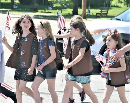 A Brownie Troop marches during the Memorial Day Parade.