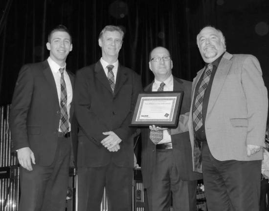 West Milford High School Music Teachers Matthew Gramata and Brian McLaughlin, with Nick Marino of the Music Shop who presented the award, and John Boronow Supervisor of Music, Art, and Family &amp; Consumer Science, grades K-12.