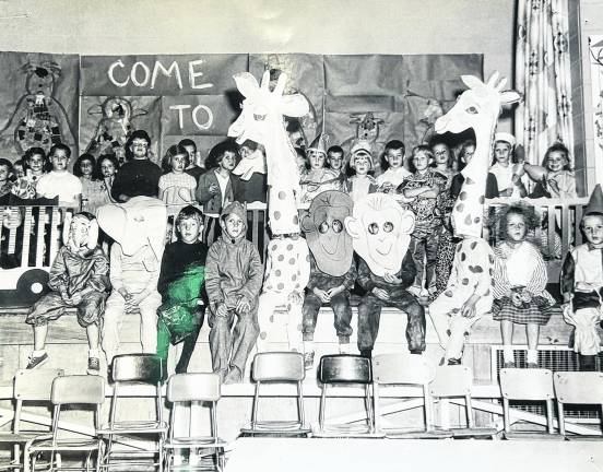 First grade students at Marshall Hill School, West Milford, in 1970 sing “Come to the Circus” (Cy Coleman music and Michael Stewart lyrics) from the Broadway Show “Barnum” as they open the show. Photo: Ann Genader