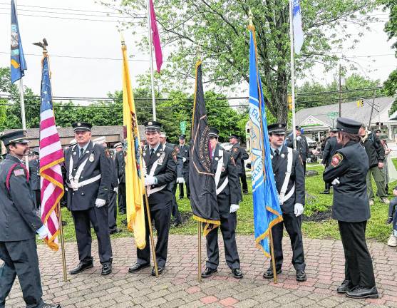The West Milford Fire Dept. color guard presents the flags.