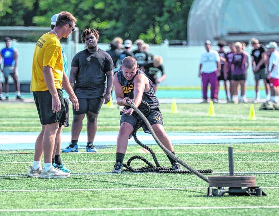 Ryder Decker performs the sled pull.
