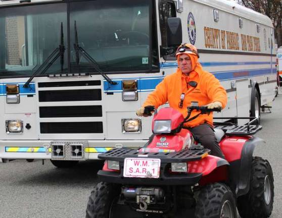 West Milford Search and Rescue member and County of Passaic EMS Task Force vehicle.
