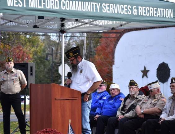 American Legion Post 289 Commander David Crum discusses the sacrifices and successes of people in the military at the ceremony at Veterans Park.