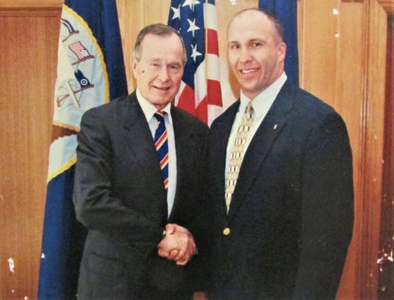 Durr family photo The late President George H.W. Bush with West Milford veteran George Durr.