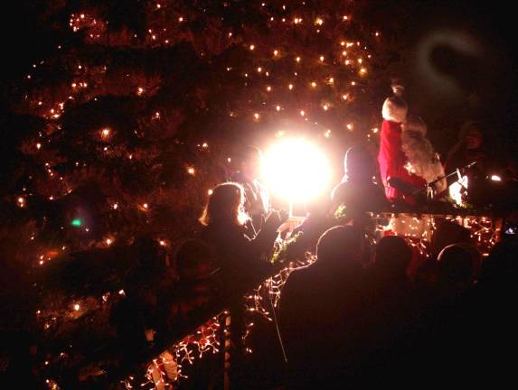 Santa hits the switch and turns on the Christmas tree lights at West Milford's Town Hall officially kicking off the holiday season for the township. Photo by Ginny Raue