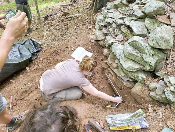 Researchers get to the bottom of the ceremonial stone landscape on Overlook Mountain.