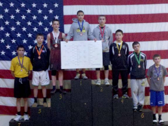 Damian Maver, a 14U wrestler, came in second in the state for his weight. He is pictured fourth from the right.