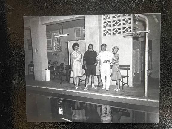 PL2 Dr. Arthur Zampella, third from left, owner of Idylease, tells adults about the basement pool.
