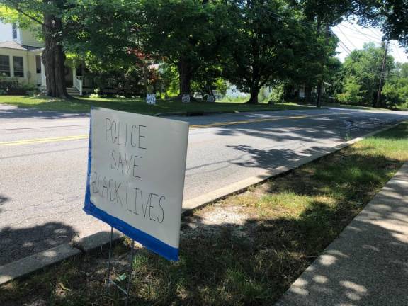 A pro-police sign across the street from Black Lives Matter signs on Forester Avenue.