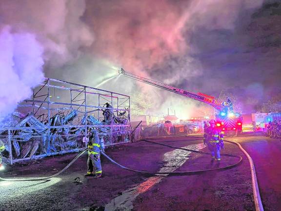 Crews battle large junkyard fire on Weaver Road in West Milford