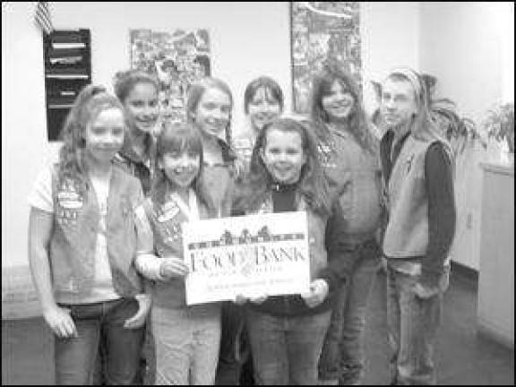 Girl Scout Troop 263 help to feed the hungry