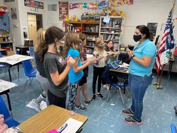 Junior girl scouts win automotive badge