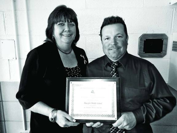 Macopin Middle School principal Mary Reinhold along with the school's Character Education Committee Chairperson Joe Trentacosta were thrilled to be awaarded an honorable mention school of character.